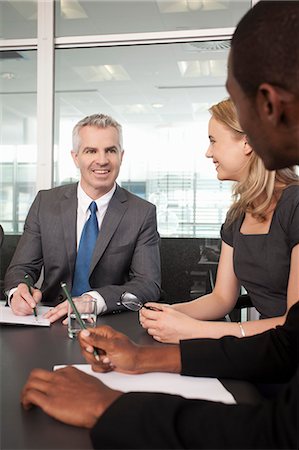 simsearch:649-07520113,k - Business manager and colleagues holding meeting in office Stock Photo - Premium Royalty-Free, Code: 649-07520802