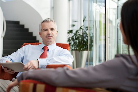 simsearch:649-07596187,k - Businessman holding interview in office Stock Photo - Premium Royalty-Free, Code: 649-07520812