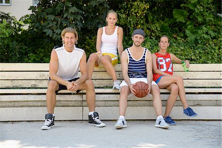 simsearch:649-07520889,k - Portrait of basketball players sitting on park bench Fotografie stock - Premium Royalty-Free, Codice: 649-07520883