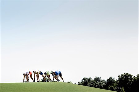 Group of adult runners preparing to run Foto de stock - Sin royalties Premium, Código: 649-07520932