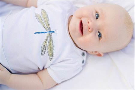 dragon fly - Baby girl smiling at camera Stock Photo - Premium Royalty-Free, Code: 649-07520978