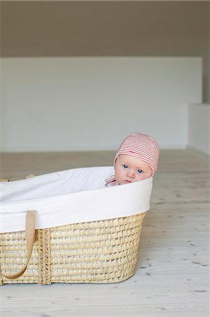 Portrait of baby girl in moses basket Stock Photo - Premium Royalty-Free, Code: 649-07521022