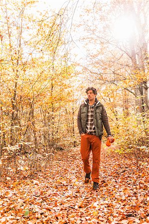 simsearch:649-07521104,k - Man walking in forest in autumn Stock Photo - Premium Royalty-Free, Code: 649-07521083