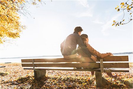 Couple sitting on bench, rear view Stock Photo - Premium Royalty-Free, Code: 649-07521114
