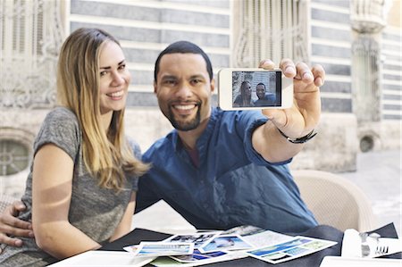 smile couple taking picture phone - Couple taking self portrait outside Museum of Ceramics, Valencia, Spain Stock Photo - Premium Royalty-Free, Code: 649-07560083