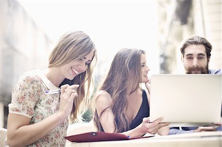 person on computer outside - Tourist friends enjoying a break at sidewalk cafe, Valencia, Spain Stock Photo - Premium Royalty-Free, Code: 649-07560111