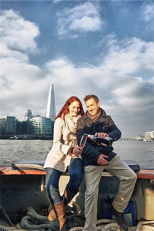 Romantic couple on Thames boat sharing pink champagne, London, UK Stock Photo - Premium Royalty-Free, Code: 649-07560245