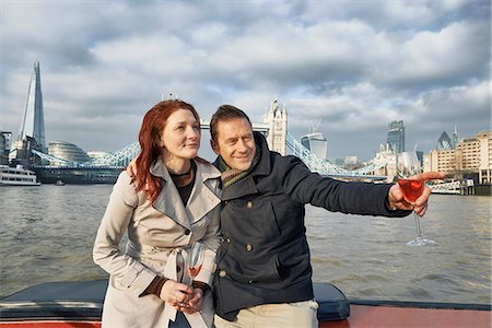 Romantic couple on Thames boat with pink champagne, London, UK Stock Photo - Premium Royalty-Free, Code: 649-07560246