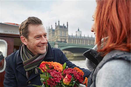 Romantic mature couple with bunch of flowers, London, UK Stock Photo - Premium Royalty-Free, Code: 649-07560251