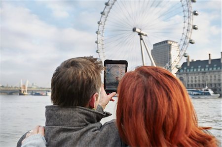 Mature tourist couple photographing London Eye, London, UK Stock Photo - Premium Royalty-Free, Code: 649-07560253