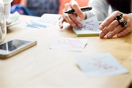 post it notes - Woman writing love notes Stock Photo - Premium Royalty-Free, Code: 649-07585161