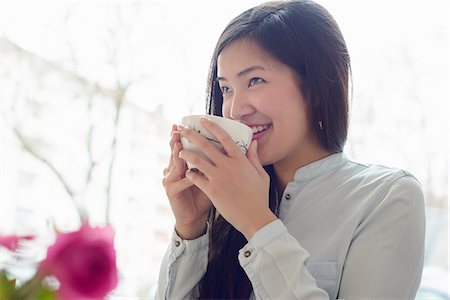 Woman relaxing with cup of tea Stock Photo - Premium Royalty-Free, Code: 649-07585171
