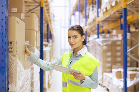 Female warehouse worker with digital tablet Stock Photo - Premium Royalty-Free, Code: 649-07585253