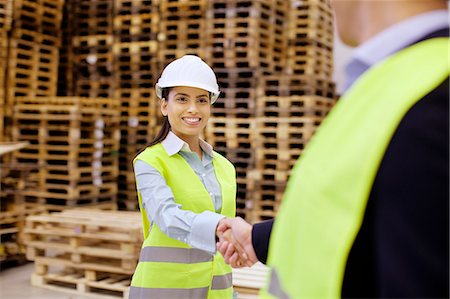 paletta - Supervisor and trainee shaking hands in distribution warehouse Stock Photo - Premium Royalty-Free, Code: 649-07585263