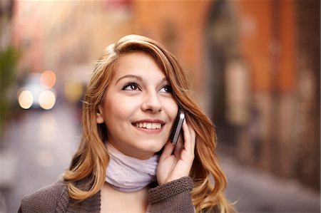 sophisticate - Young woman chatting on smartphone on Rome street, Italy Stock Photo - Premium Royalty-Free, Code: 649-07585555