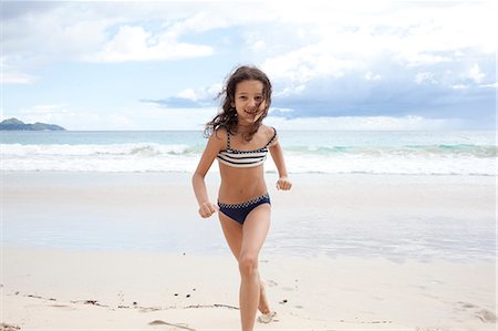 simsearch:649-07585546,k - Girl running on beach in Seychelles Photographie de stock - Premium Libres de Droits, Code: 649-07585550