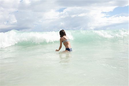 elementary age beach - Girl playing in sea Stock Photo - Premium Royalty-Free, Code: 649-07585551