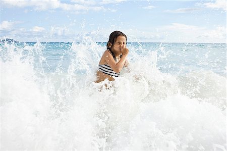 plugging nose - Girl playing in sea, holding nose Stock Photo - Premium Royalty-Free, Code: 649-07585553