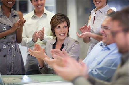 partenaire (affaires) - Mature businessman and colleagues celebrating in office Foto de stock - Sin royalties Premium, Código: 649-07596189