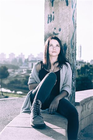 simsearch:649-03566205,k - Young woman sitting on wall Stock Photo - Premium Royalty-Free, Code: 649-07596311