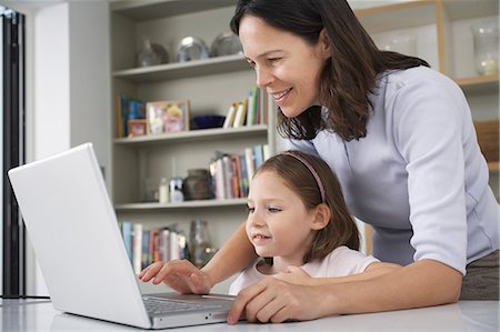 simsearch:649-09035514,k - Mother and young daughter using laptop Stock Photo - Premium Royalty-Free, Code: 649-07596355