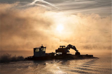 simsearch:6115-08066398,k - Silhouette of excavator on barge,  Lake Maggiore, Stresa, Piemonte, Italy Stock Photo - Premium Royalty-Free, Code: 649-07596470