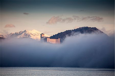 peaceful scenic not people - Mist and Castello di Angera, Lake Maggiore, Italy Stock Photo - Premium Royalty-Free, Code: 649-07596472