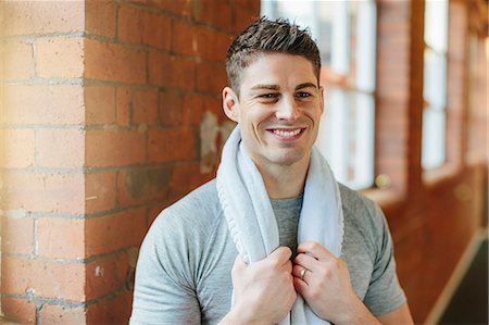 Man in gym with towel around neck Stock Photo - Premium Royalty-Free, Code: 649-07596662
