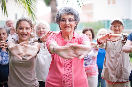 simsearch:614-07031758,k - Medium group of seniors exercising in retirement villa garden Stock Photo - Premium Royalty-Free, Code: 649-07596676