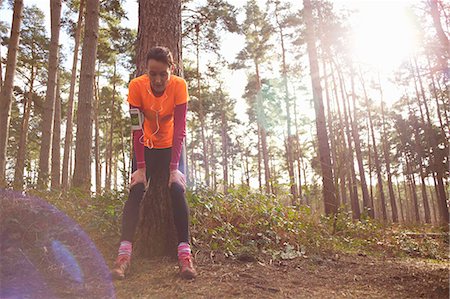 runner - Mature woman runner taking a break in a forest Stock Photo - Premium Royalty-Free, Code: 649-07596722