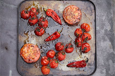 roasted tomatoes above - Tray of roasted tomatoes and chillis Stock Photo - Premium Royalty-Free, Code: 649-07647834