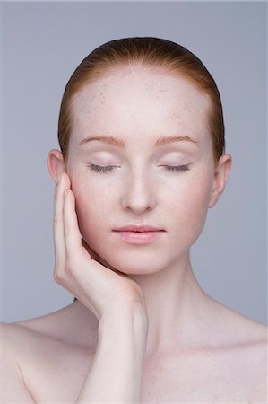 Portrait of young woman, eyes closed Stock Photo - Premium Royalty-Free, Code: 649-07647865