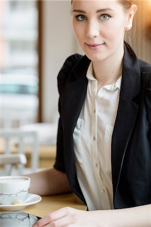 simsearch:614-07031976,k - Young businesswoman in cafe having a coffee Stock Photo - Premium Royalty-Free, Code: 649-07647962