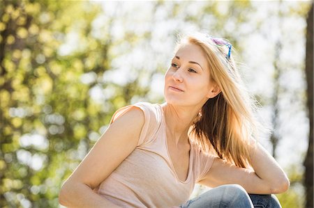 simsearch:649-08565670,k - Portrait of young woman gazing calmly in forest Stock Photo - Premium Royalty-Free, Code: 649-07648052