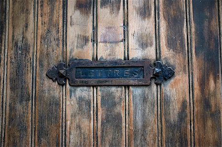 front door letter box - Detail of rustic letterbox and wooden door Stock Photo - Premium Royalty-Free, Code: 649-07648231