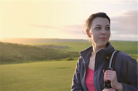 east sussex - Young female hiker looking over her shoulder Stock Photo - Premium Royalty-Free, Code: 649-07648257