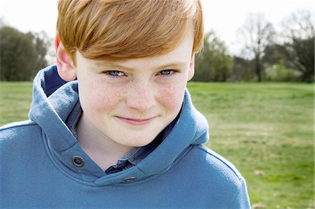 red hair - Close up portrait of boy in field Stock Photo - Premium Royalty-Free, Code: 649-07648250