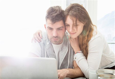 Young couple using laptop Stock Photo - Premium Royalty-Free, Code: 649-07648563