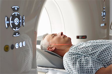 diagnostic - Man going into CT scanner Stock Photo - Premium Royalty-Free, Code: 649-07709917
