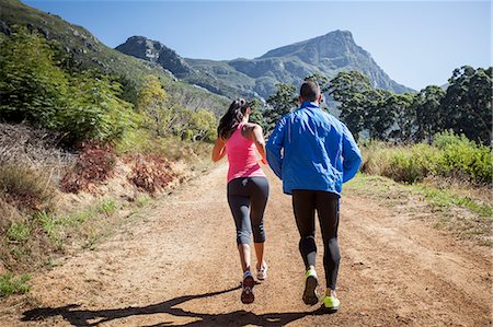 simsearch:649-07710123,k - Young couple jogging in forest Photographie de stock - Premium Libres de Droits, Code: 649-07710115