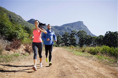 simsearch:649-07710130,k - Young couple jogging in forest Stockbilder - Premium RF Lizenzfrei, Bildnummer: 649-07710116