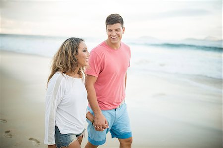 Young couple strolling hand in hand on Ipanema Beach, Rio de Janeiro, Brazil Stock Photo - Premium Royalty-Free, Code: 649-07710201