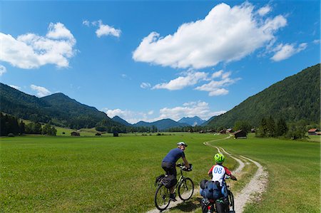 simsearch:649-07437984,k - Father and son cycling through Jachenau, Bavaria, Germany Photographie de stock - Premium Libres de Droits, Code: 649-07710324