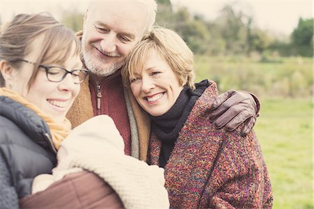 daughter caring for senior mom - Mother holding baby son, with grandparents Stock Photo - Premium Royalty-Free, Code: 649-07710400