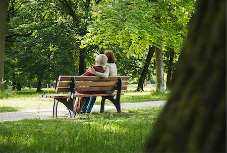 simsearch:649-08328527,k - Senior woman sitting on park bench with granddaughter Stock Photo - Premium Royalty-Free, Code: 649-07710568