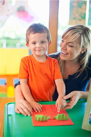 simsearch:614-09017463,k - Portrait of boy and teacher counting at nursery school Stock Photo - Premium Royalty-Free, Code: 649-07710800