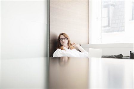 simsearch:614-07708118,k - Mid adult businesswoman contemplating in new office Stock Photo - Premium Royalty-Free, Code: 649-07736453