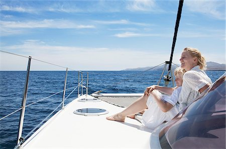 sailing on atlantic ocean - Mid adult mother son sailing on catamaran near Fuerteventura, Spain Stock Photo - Premium Royalty-Free, Code: 649-07736515