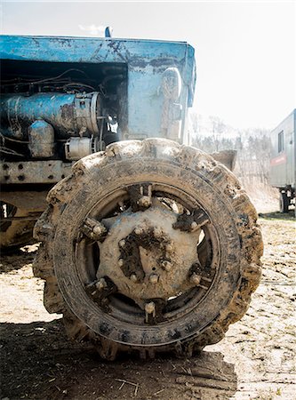 russia - Close up of old rustic tractor in farmyard Stock Photo - Premium Royalty-Free, Code: 649-07736642