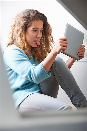 preteen selfie - Young girl using digital tablet Stock Photo - Premium Royalty-Free, Code: 649-07736654